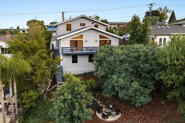 a view of a house with a yard and plants