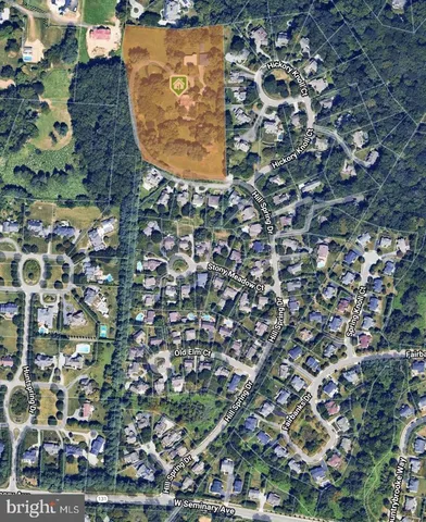 an aerial view of residential houses with lake view