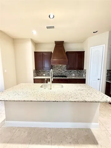 a view of kitchen countertops with cabinets