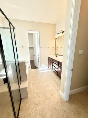 a view of a hallway view with wooden floor and staircase