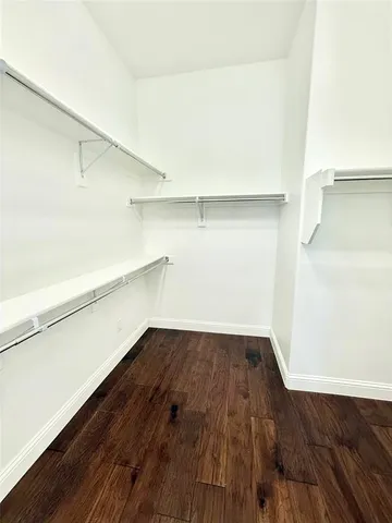 a view of an empty walk in closet