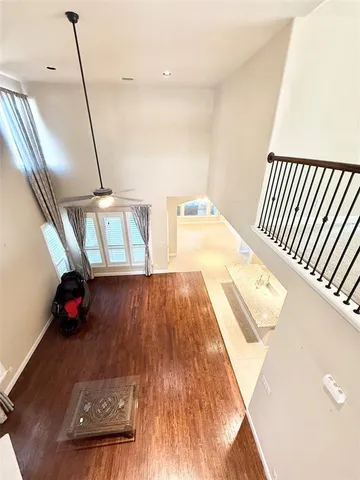 a view of a living room with wooden floor