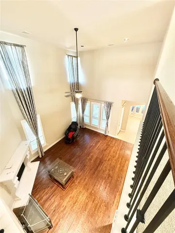 a view of an empty room and a window