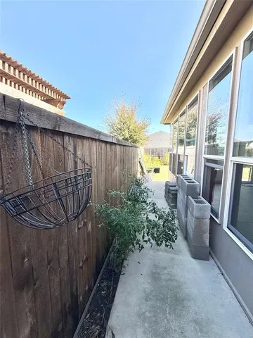 a view of a balcony with wooden floor and stairs