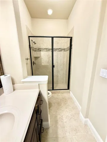 a living room with a couch and a sliding door