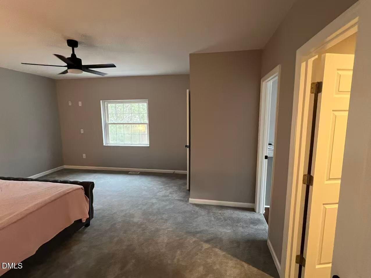 409 Rockingham Street Carthage, NC 28327 - Photo 36 of 56 a bed room with a bed and a window