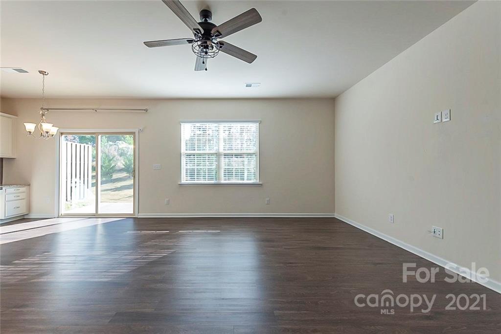 541 Dulaney Drive Fort Mill, SC 29708 - Photo 5 of 16 wooden floor in an empty room with a window
