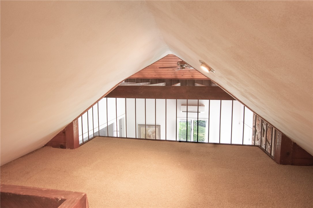 200 Chenault Road Townville, SC 29689 - Photo 9 of 47 A versatile loft space offers a unique vantage point over the lower level, ideal for an office or relaxation.