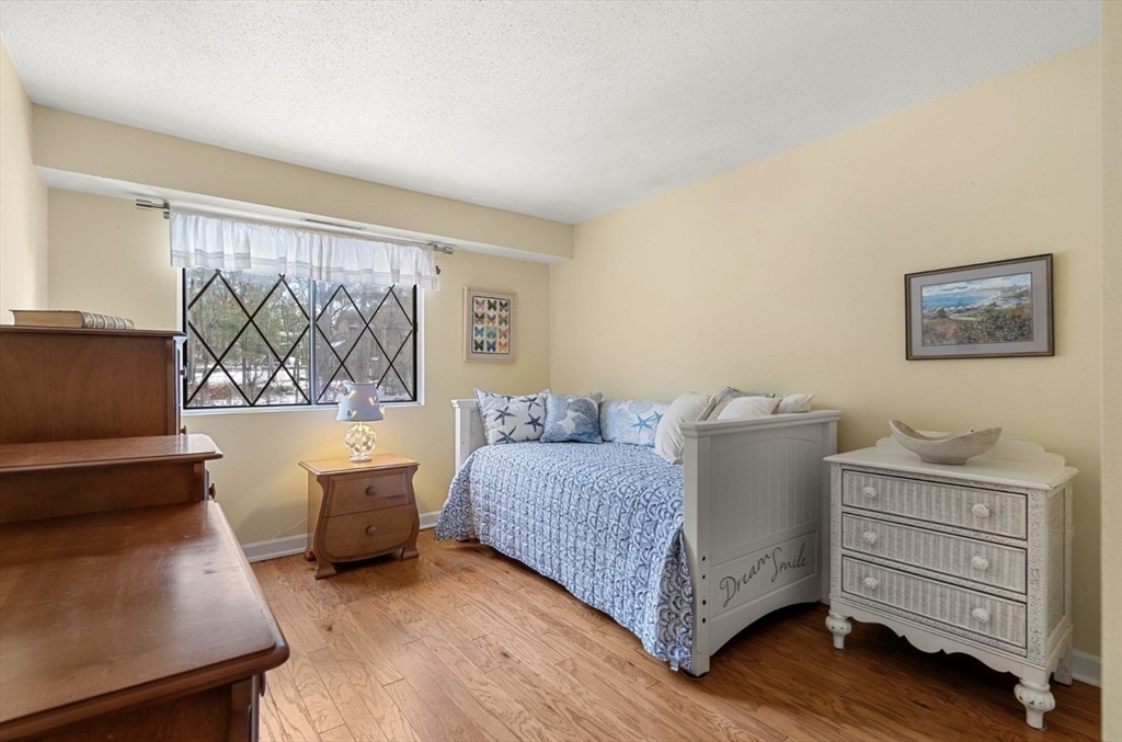 7 Greenbriar Drive, Unit 304 North Reading, MA 01864 - Photo 17 of 23 a living room with furniture and a window