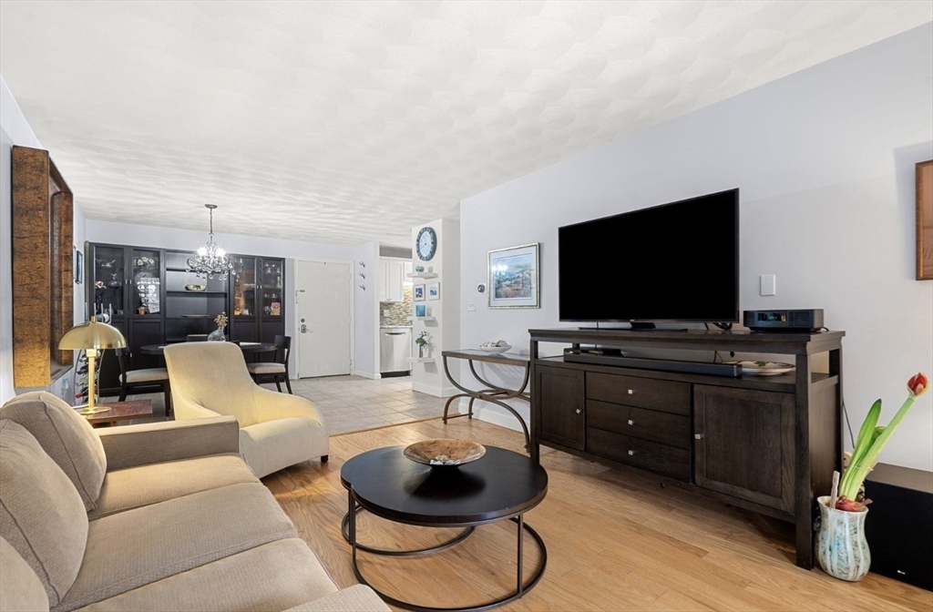 7 Greenbriar Drive, Unit 304 North Reading, MA 01864 - Photo 4 of 23 a living room with furniture and a flat screen tv