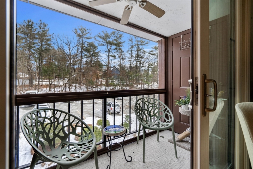 7 Greenbriar Drive, Unit 304 North Reading, MA 01864 - Photo 5 of 23 a view of a balcony with chairs