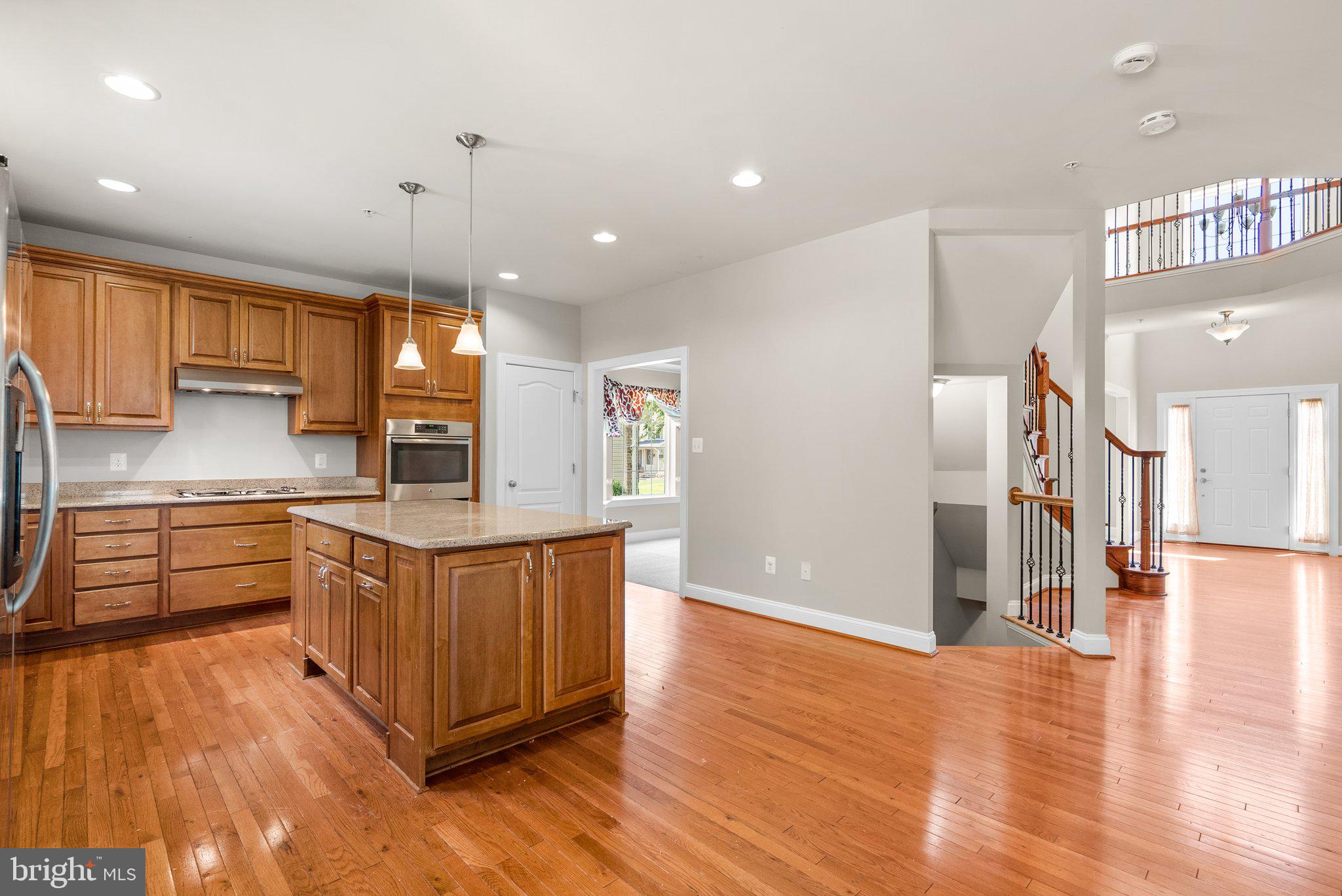 9602 Pep Rally Lane Waldorf, MD 20603 - Photo 12 of 44 a kitchen with stainless steel appliances granite countertop a stove and a sink