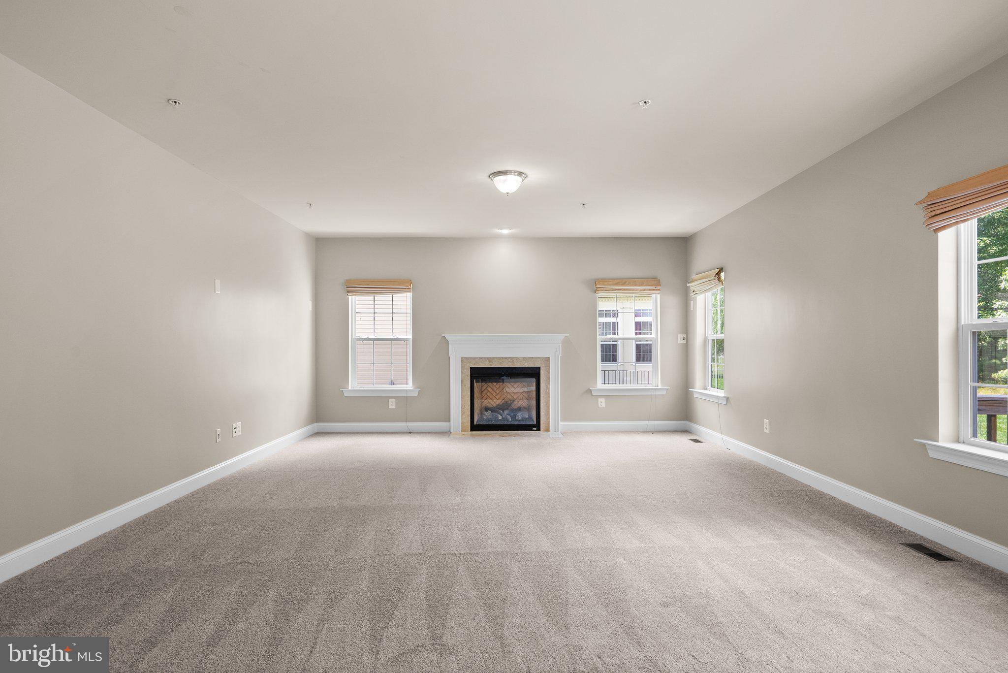 9602 Pep Rally Lane Waldorf, MD 20603 - Photo 18 of 44 a view of an empty room with a window and fireplace