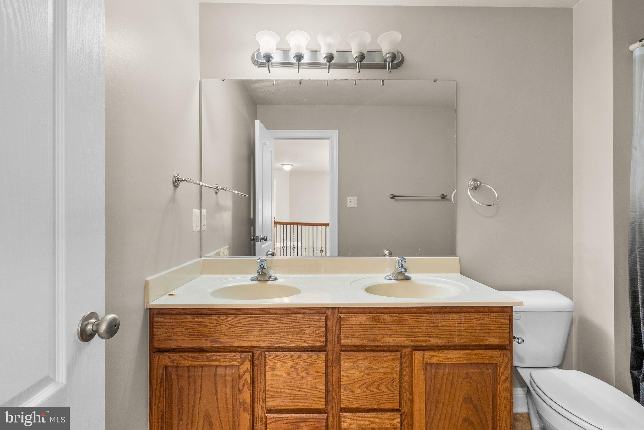 9602 Pep Rally Lane Waldorf, MD 20603 - Photo 30 of 44 a bathroom with a sink and a mirror