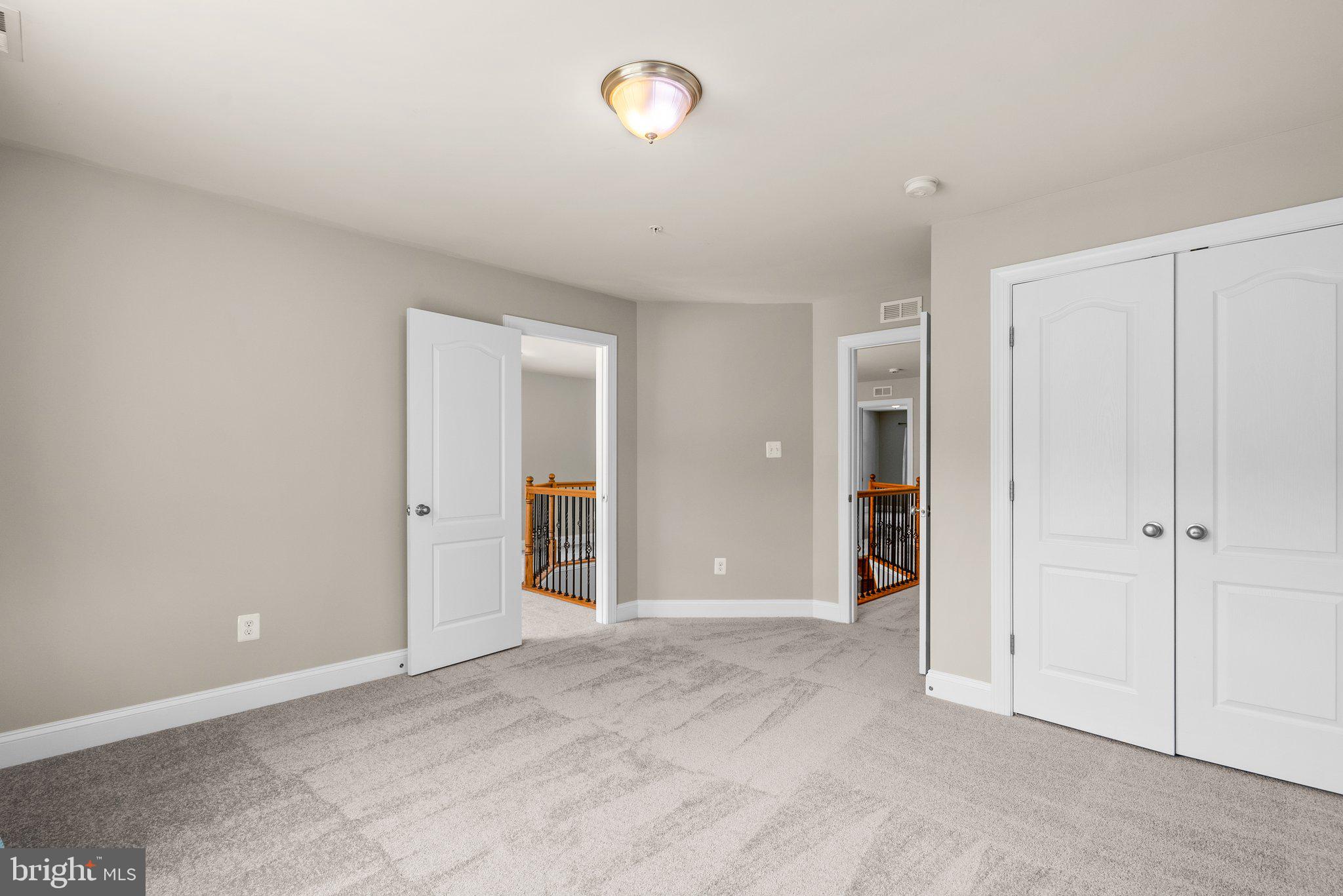 9602 Pep Rally Lane Waldorf, MD 20603 - Photo 32 of 44 an empty room with closet area and bathroom