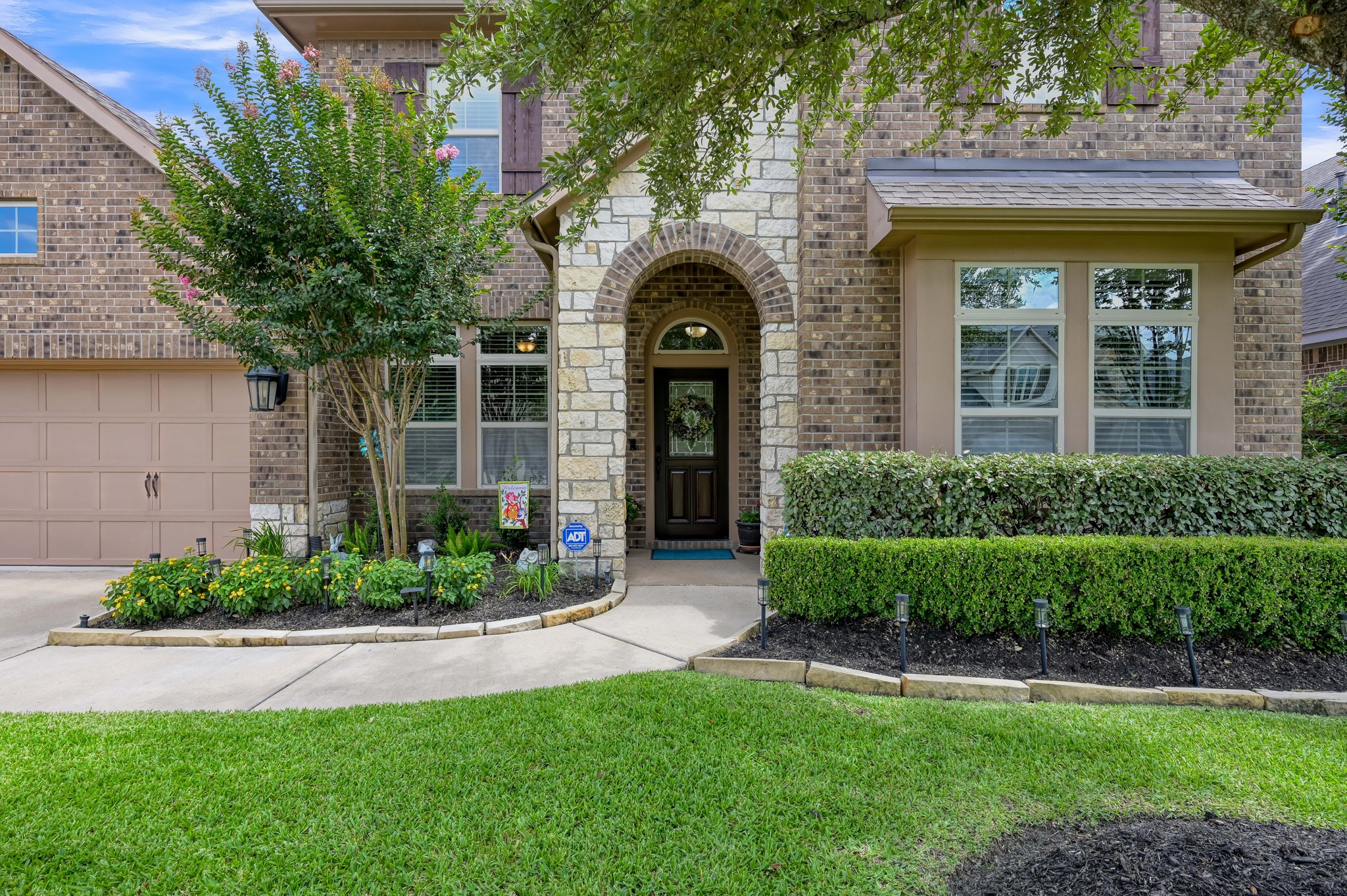 31742 Serrano Bluff Lane Spring, TX 77386 - Photo 2 of 40 Gorgeous curb appeal with exquisite landscaping.
