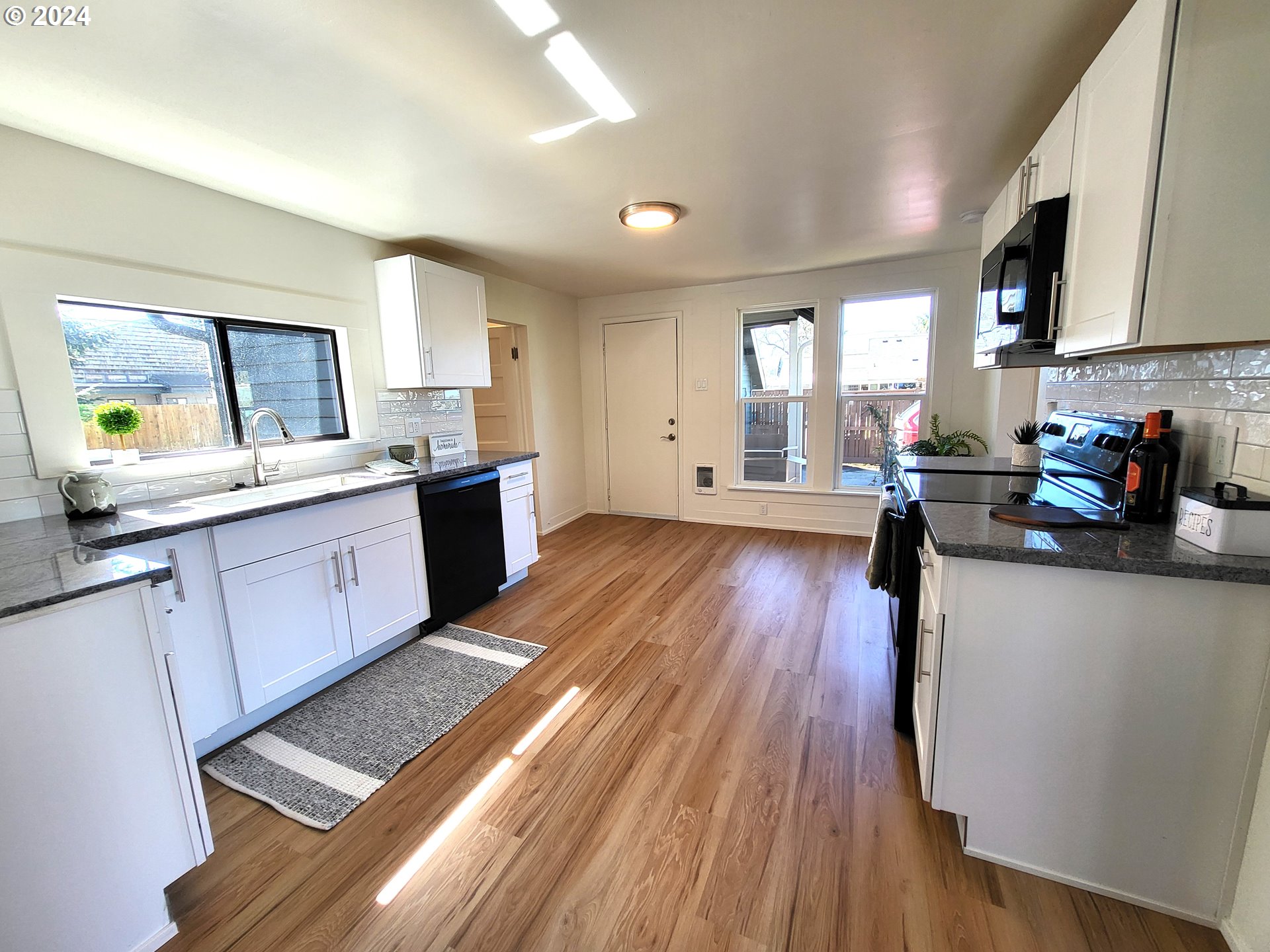 1029 A Street Springfield, OR 97477 - Photo 14 of 27 a kitchen with a sink a window and appliances