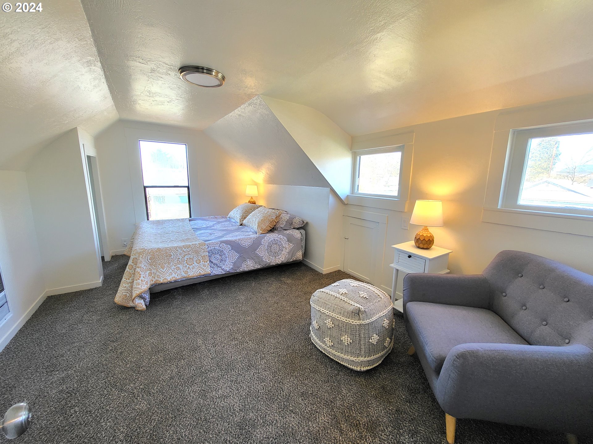 1029 A Street Springfield, OR 97477 - Photo 17 of 27 a bedroom with bed and window
