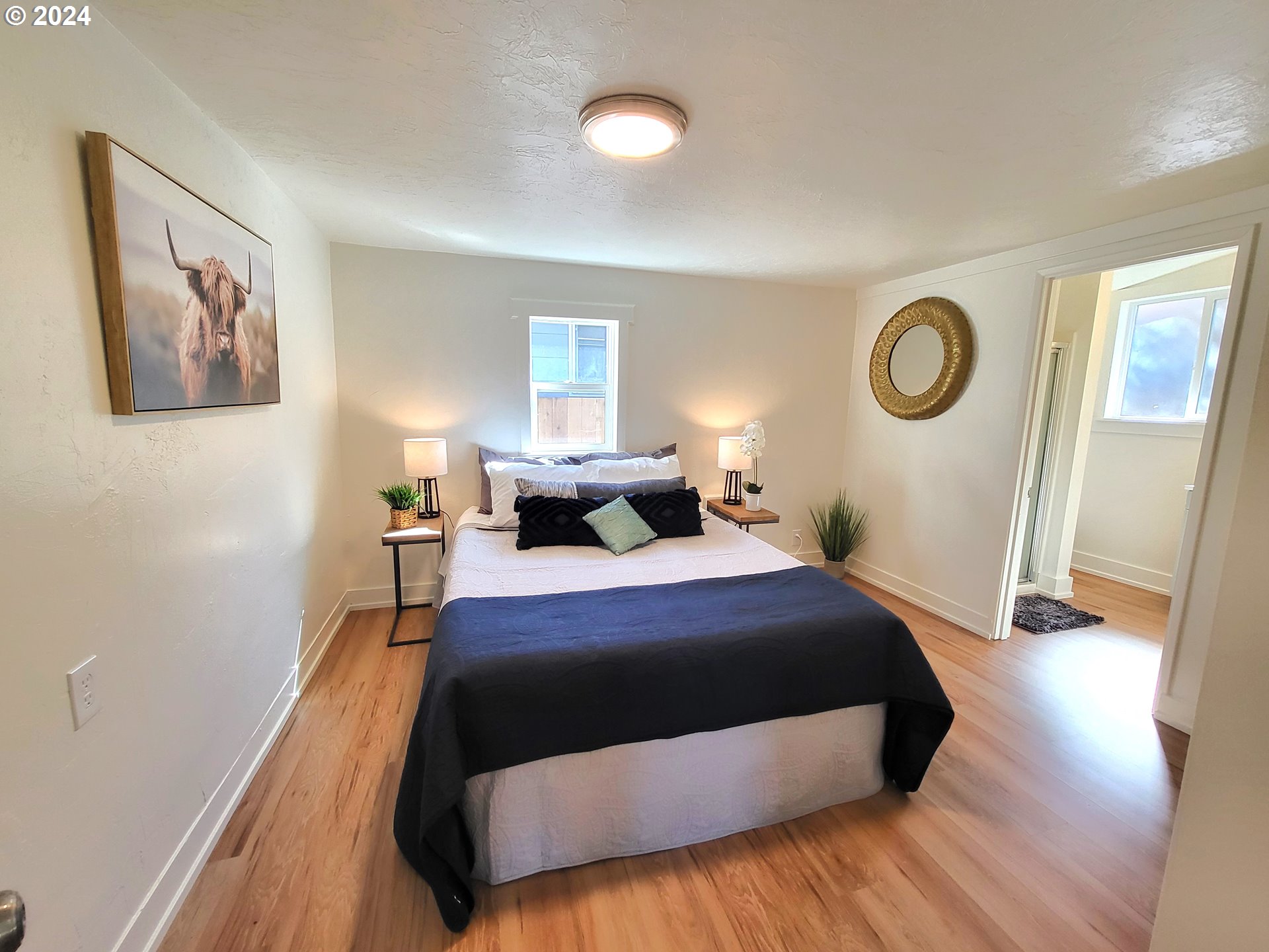 1029 A Street Springfield, OR 97477 - Photo 19 of 27 a bedroom with a bed and a window