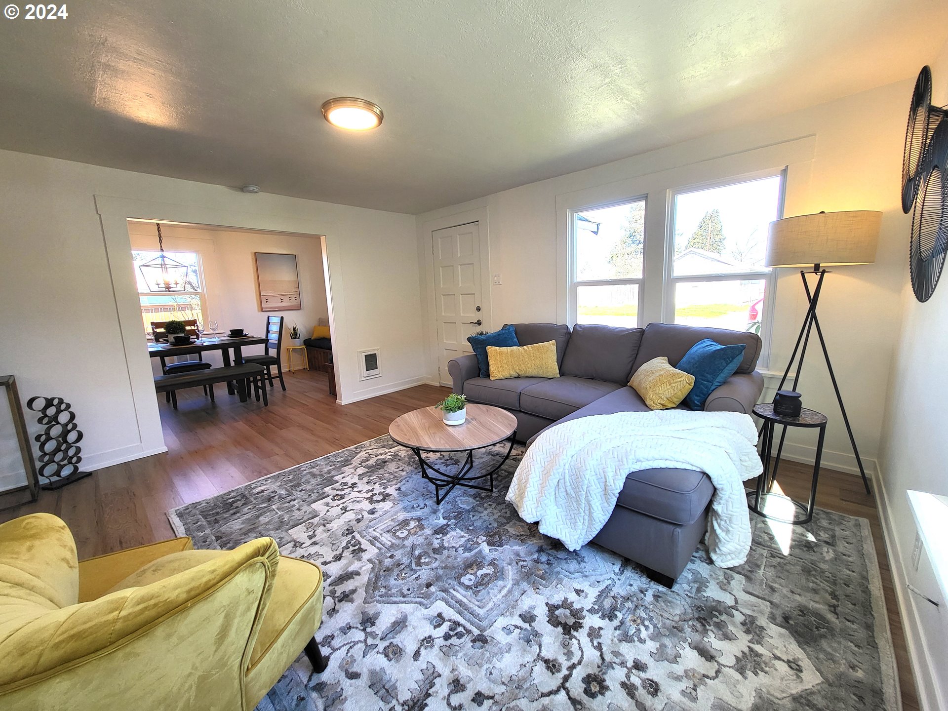 1029 A Street Springfield, OR 97477 - Photo 5 of 27 a living room with furniture a lamp and a window