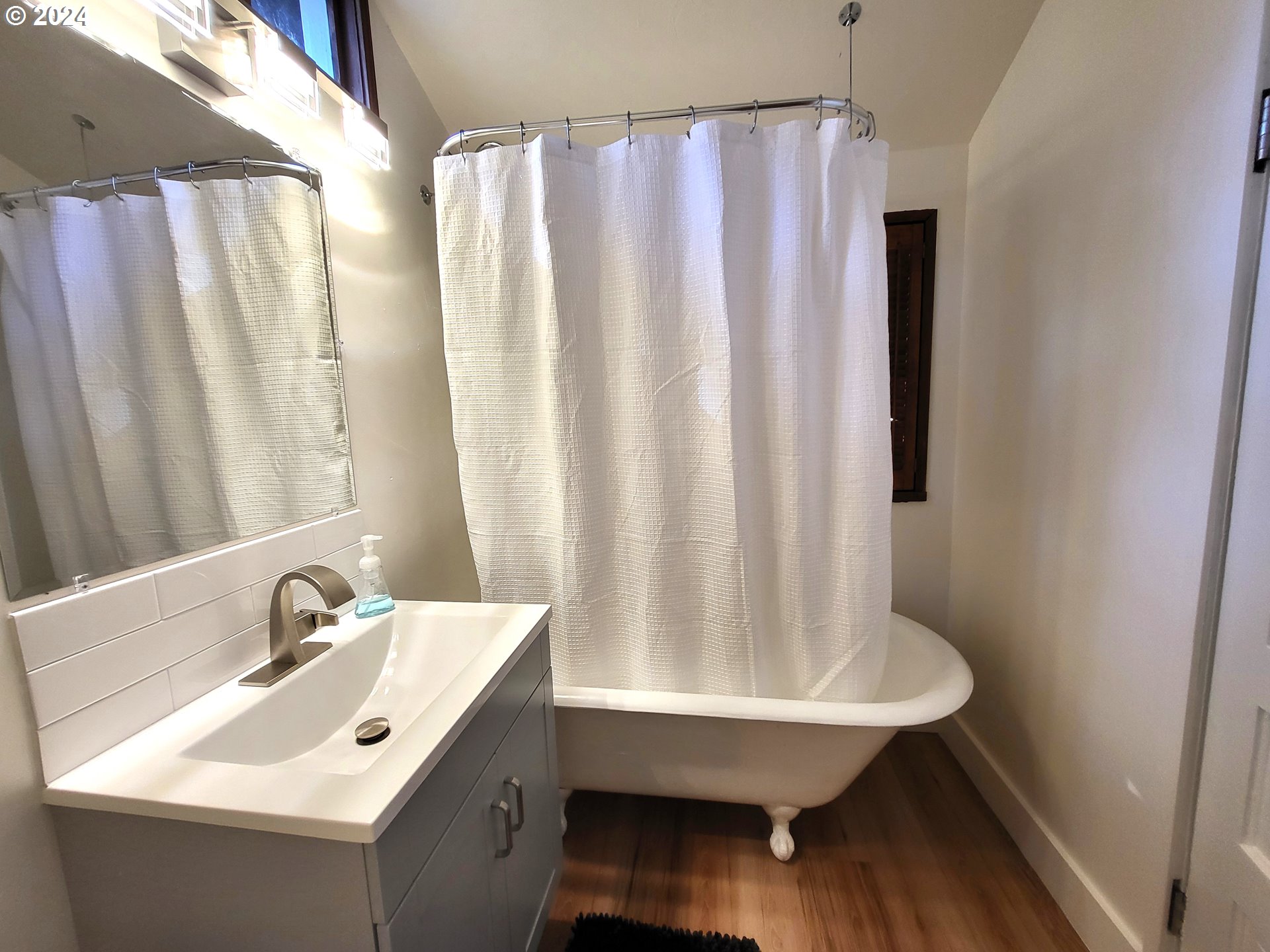 1029 A Street Springfield, OR 97477 - Photo 9 of 27 a bathroom with a sink and a mirror