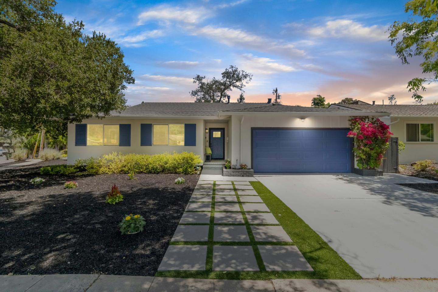 a front view of a house with garden