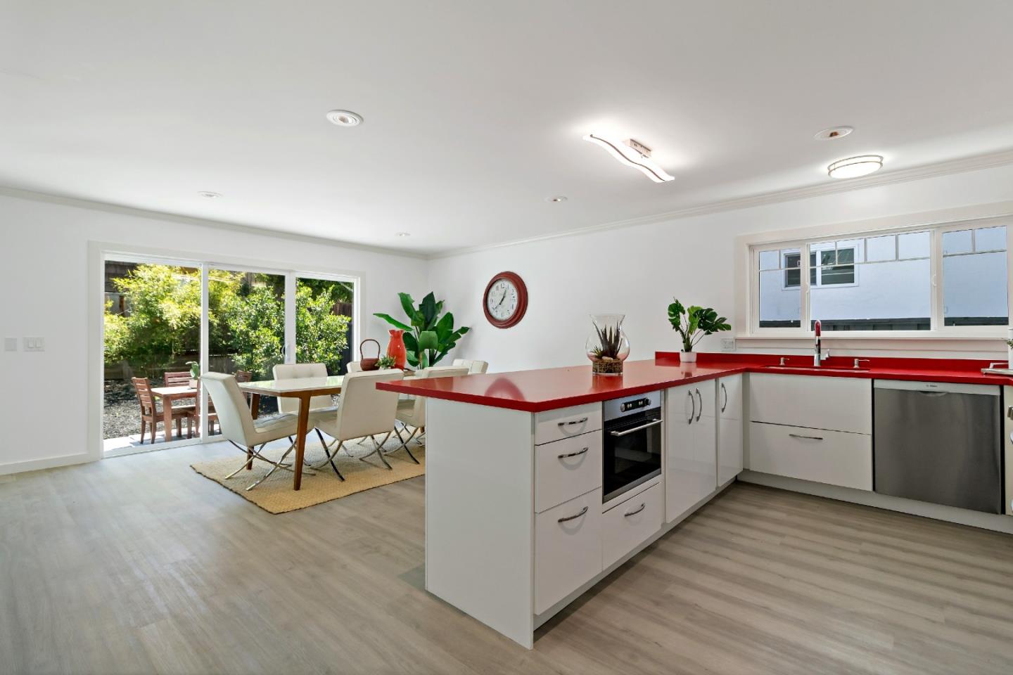 1502 Petersen Avenue San Jose, CA 95129 - Photo 11 of 56 a kitchen with stainless steel appliances granite countertop a white cabinets and wooden floors