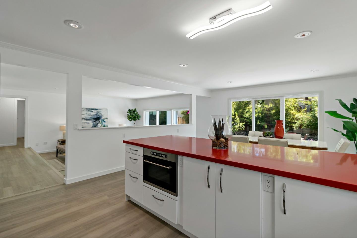 1502 Petersen Avenue San Jose, CA 95129 - Photo 12 of 56 a kitchen with stainless steel appliances a sink and stove