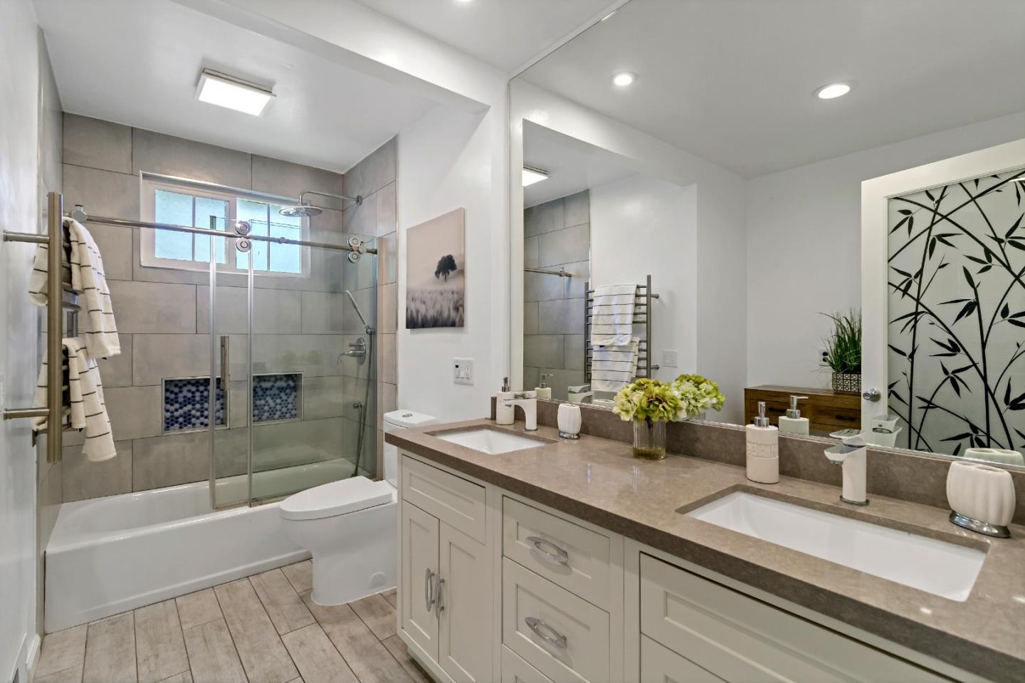 1502 Petersen Avenue San Jose, CA 95129 - Photo 23 of 56 a bathroom with a double vanity sink toilet and shower