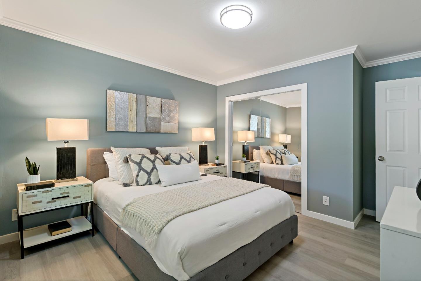 1502 Petersen Avenue San Jose, CA 95129 - Photo 25 of 56 a bedroom with a bed and a lamp