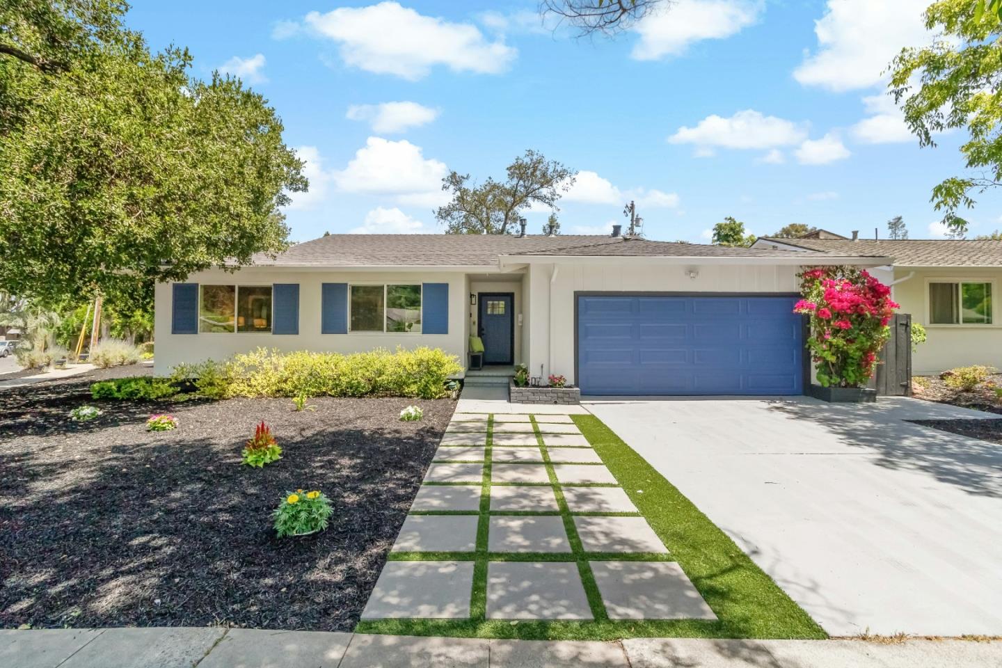 1502 Petersen Avenue San Jose, CA 95129 - Photo 3 of 56 a front view of a house with a yard