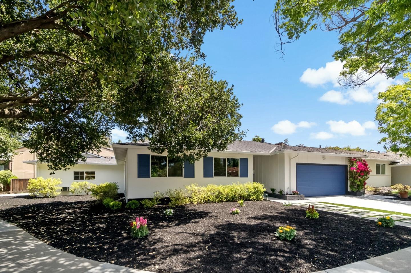 1502 Petersen Avenue San Jose, CA 95129 - Photo 4 of 56 a front view of a house with a porch
