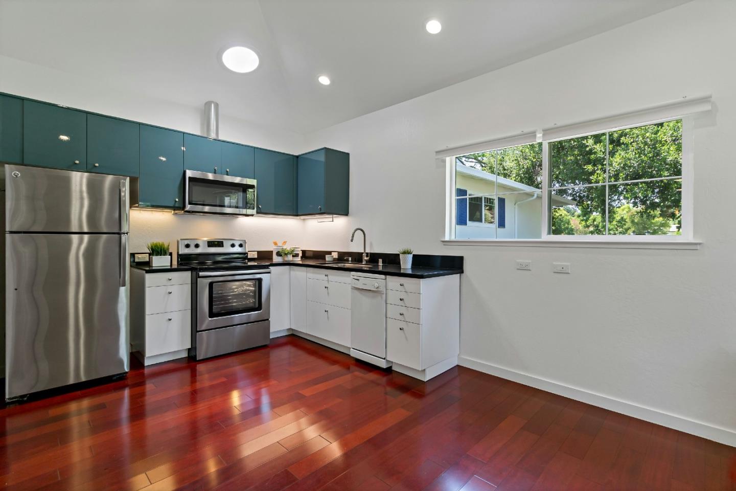 1502 Petersen Avenue San Jose, CA 95129 - Photo 41 of 56 a kitchen with stainless steel appliances a refrigerator and a stove top oven