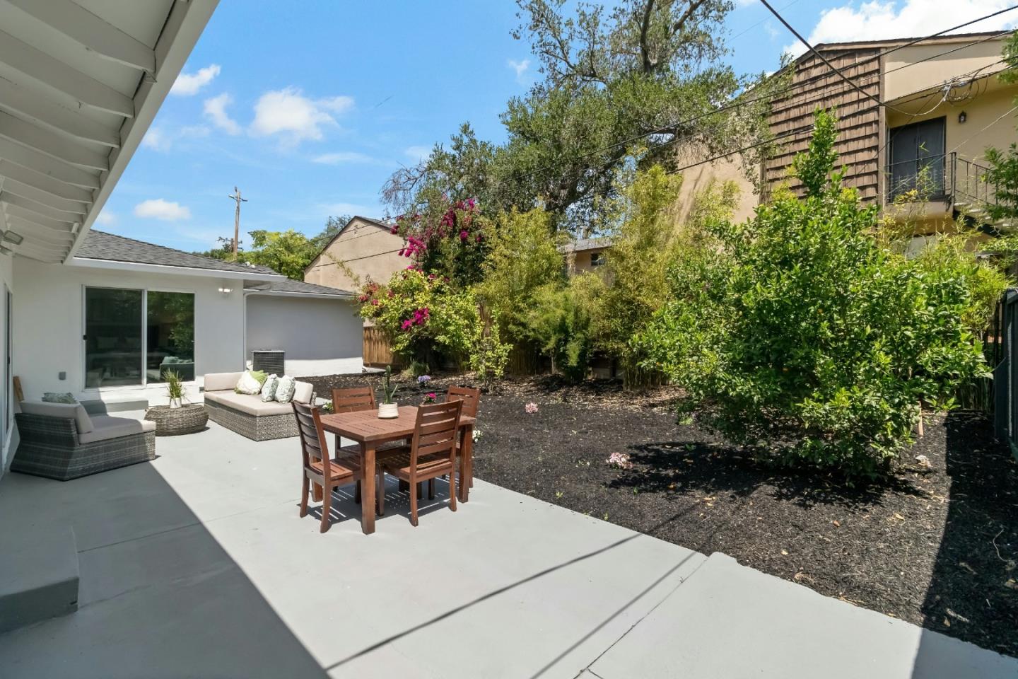 1502 Petersen Avenue San Jose, CA 95129 - Photo 48 of 56 a view of a house with backyard sitting area and garden