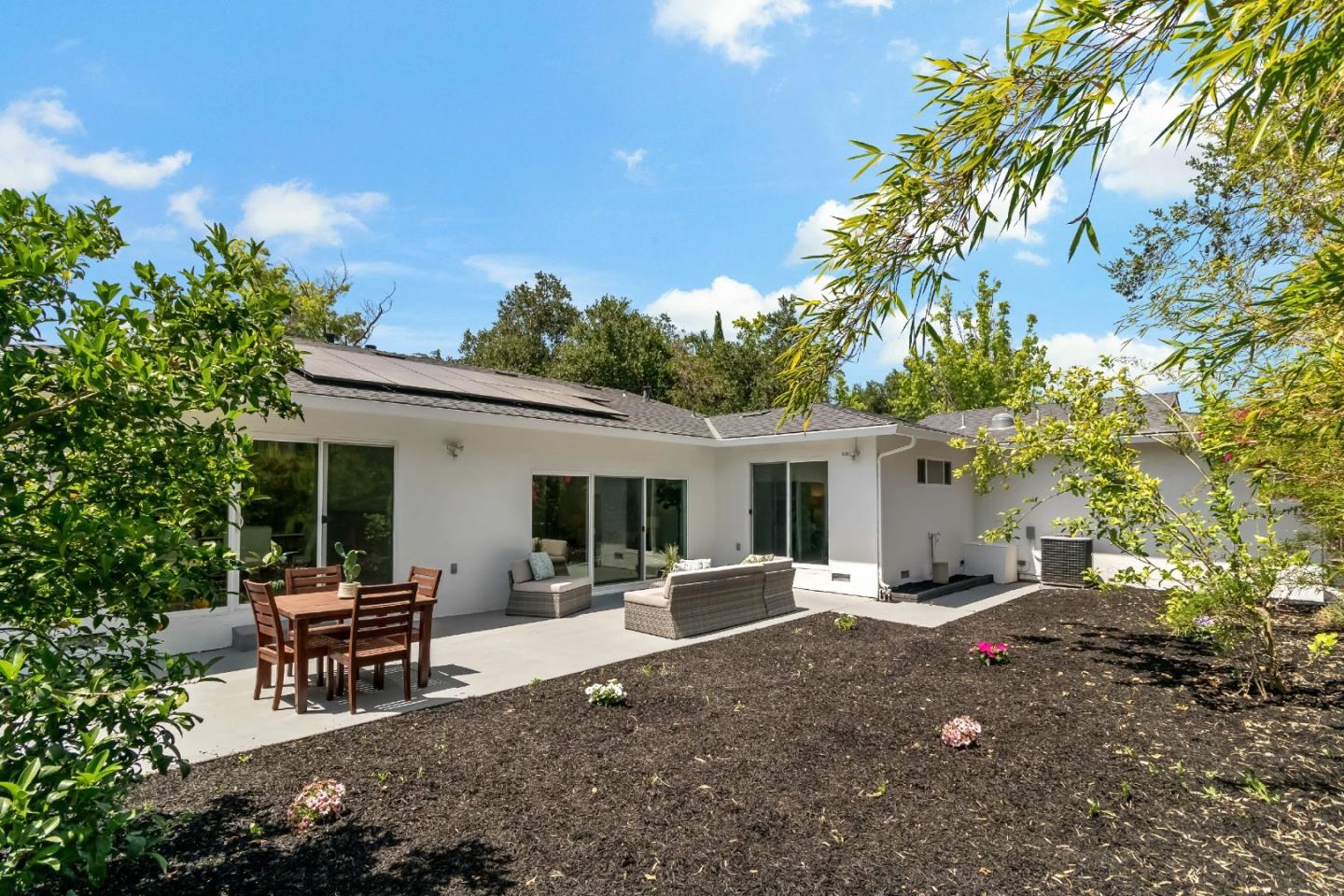 1502 Petersen Avenue San Jose, CA 95129 - Photo 49 of 56 a backyard of a house with yard and outdoor seating