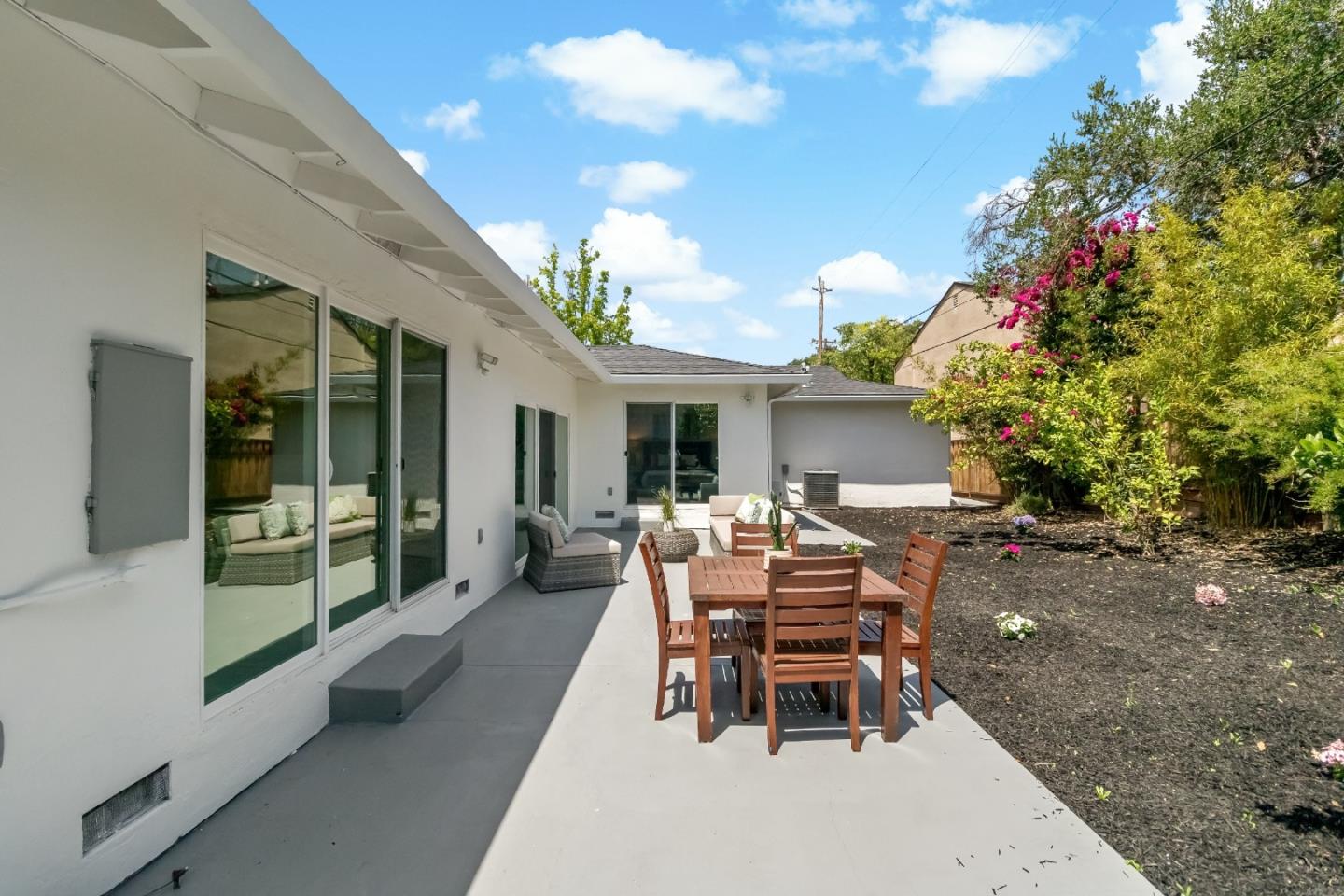 1502 Petersen Avenue San Jose, CA 95129 - Photo 50 of 56 a view of a house with backyard sitting area and garden