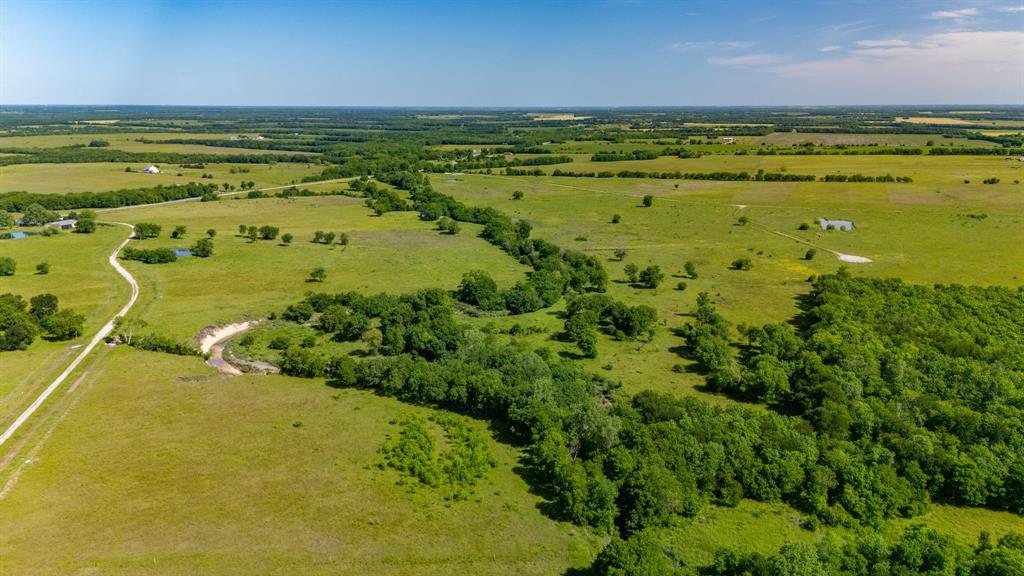 1625 Fm 904 Street South, Unit ES Commerce, TX 75428 - Photo 20 of 22 a view of an ocean and a houses