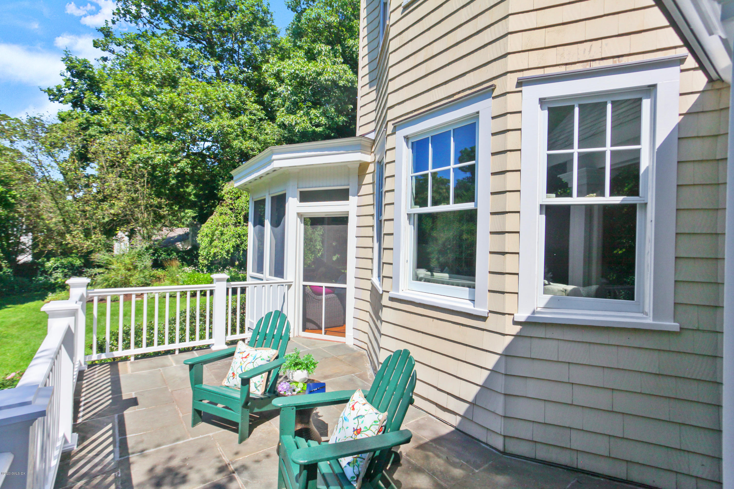 29 Weston Hill Road Riverside, CT 06878 - Photo 13 of 39 a view of a patio with a table and chairs