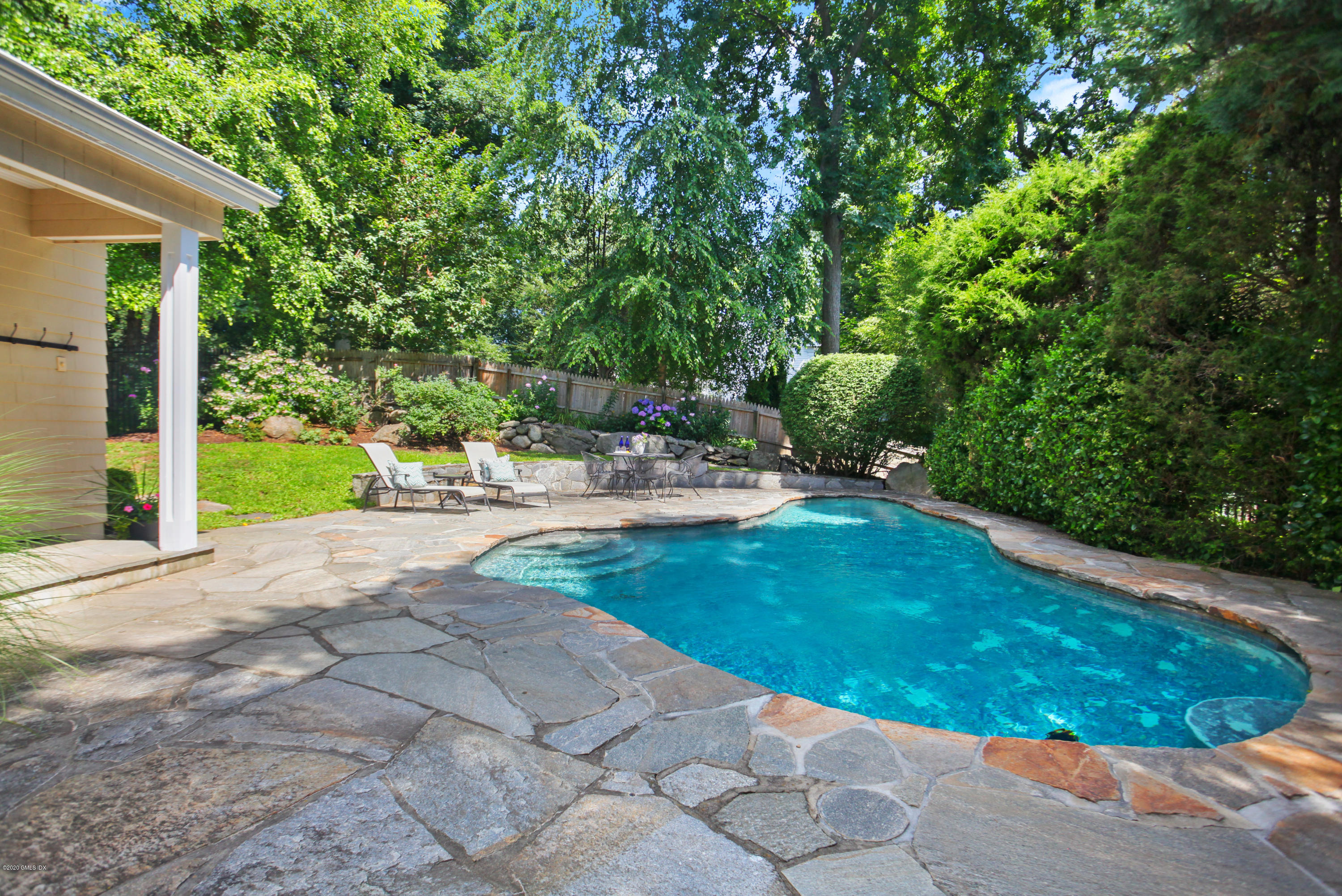 29 Weston Hill Road Riverside, CT 06878 - Photo 18 of 39 a backyard of a house with yard and outdoor seating