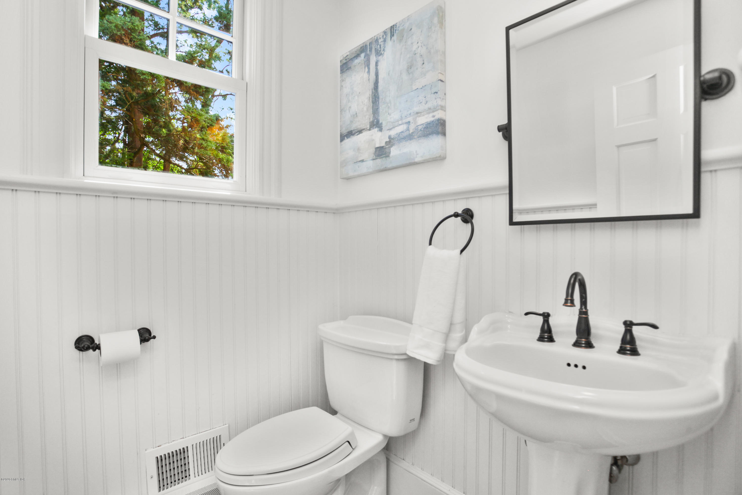 29 Weston Hill Road Riverside, CT 06878 - Photo 19 of 39 a bathroom with a toilet sink and mirror