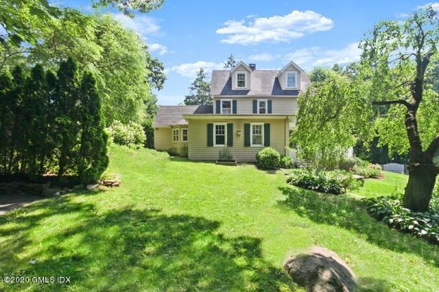 29 Weston Hill Road Riverside, CT 06878 - Photo 2 of 39 a view of a house with a big yard plants and large trees