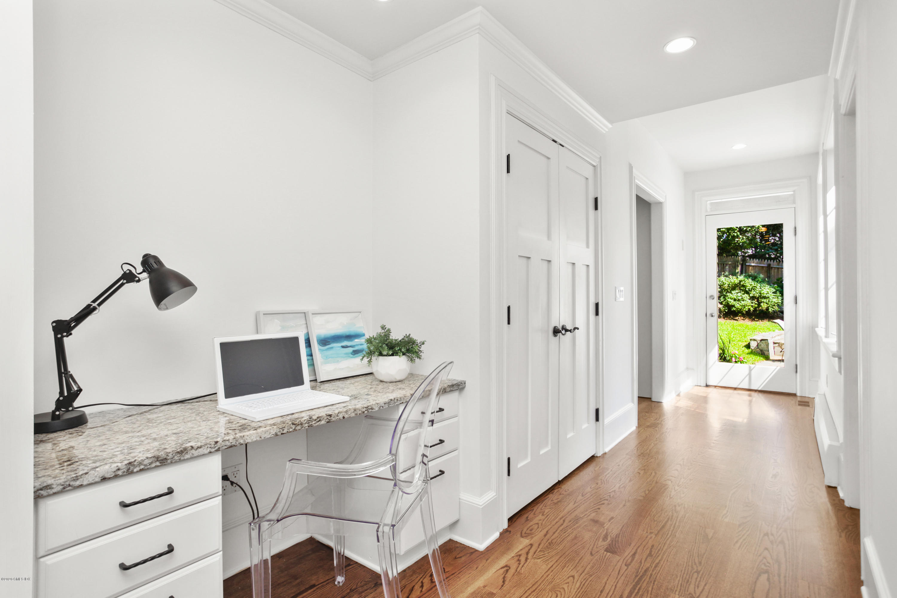 29 Weston Hill Road Riverside, CT 06878 - Photo 21 of 39 a kitchen with granite countertop white cabinets and window