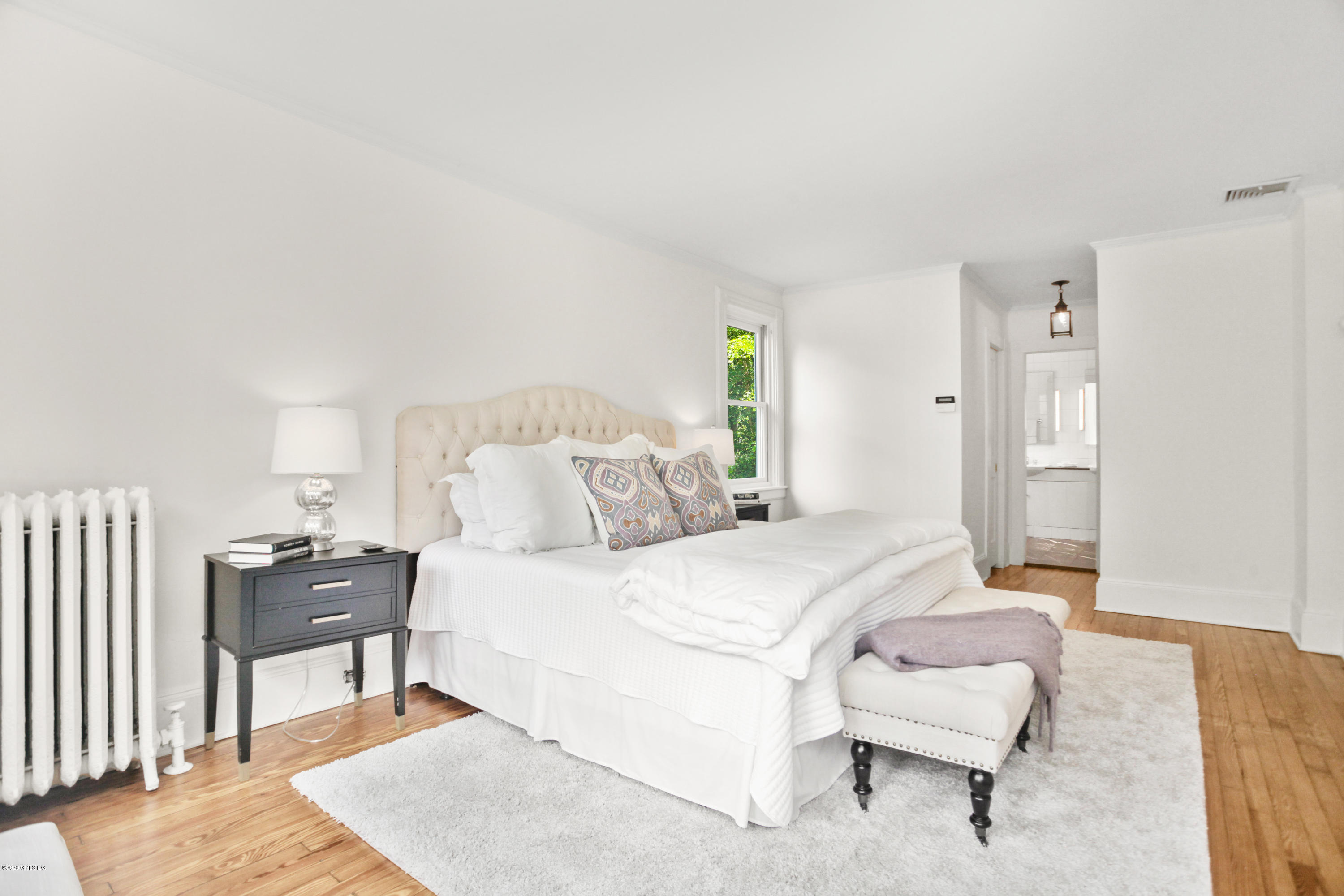 29 Weston Hill Road Riverside, CT 06878 - Photo 25 of 39 a bedroom with a bed and a table