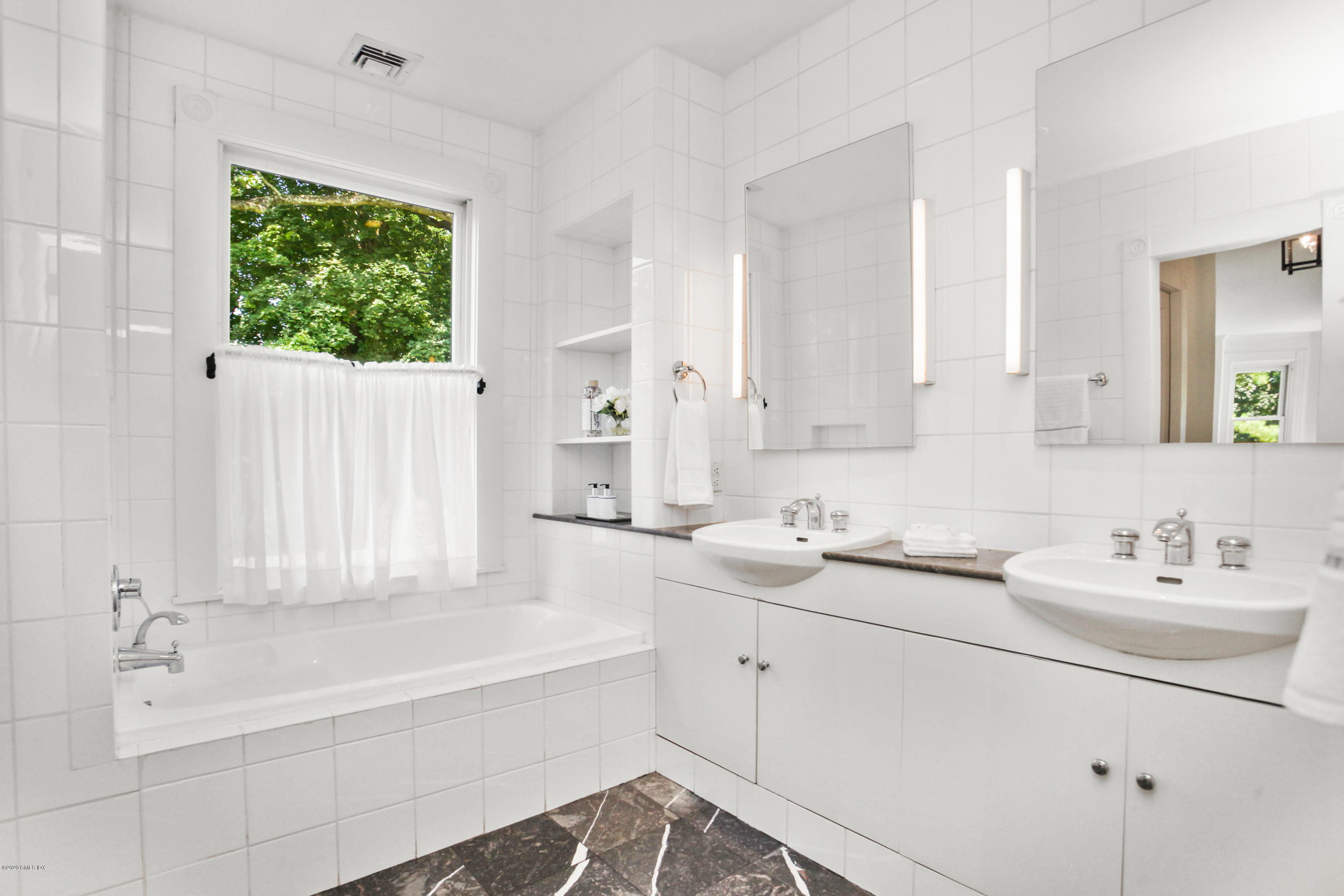 29 Weston Hill Road Riverside, CT 06878 - Photo 28 of 39 a bathroom with a sink and a bathtub