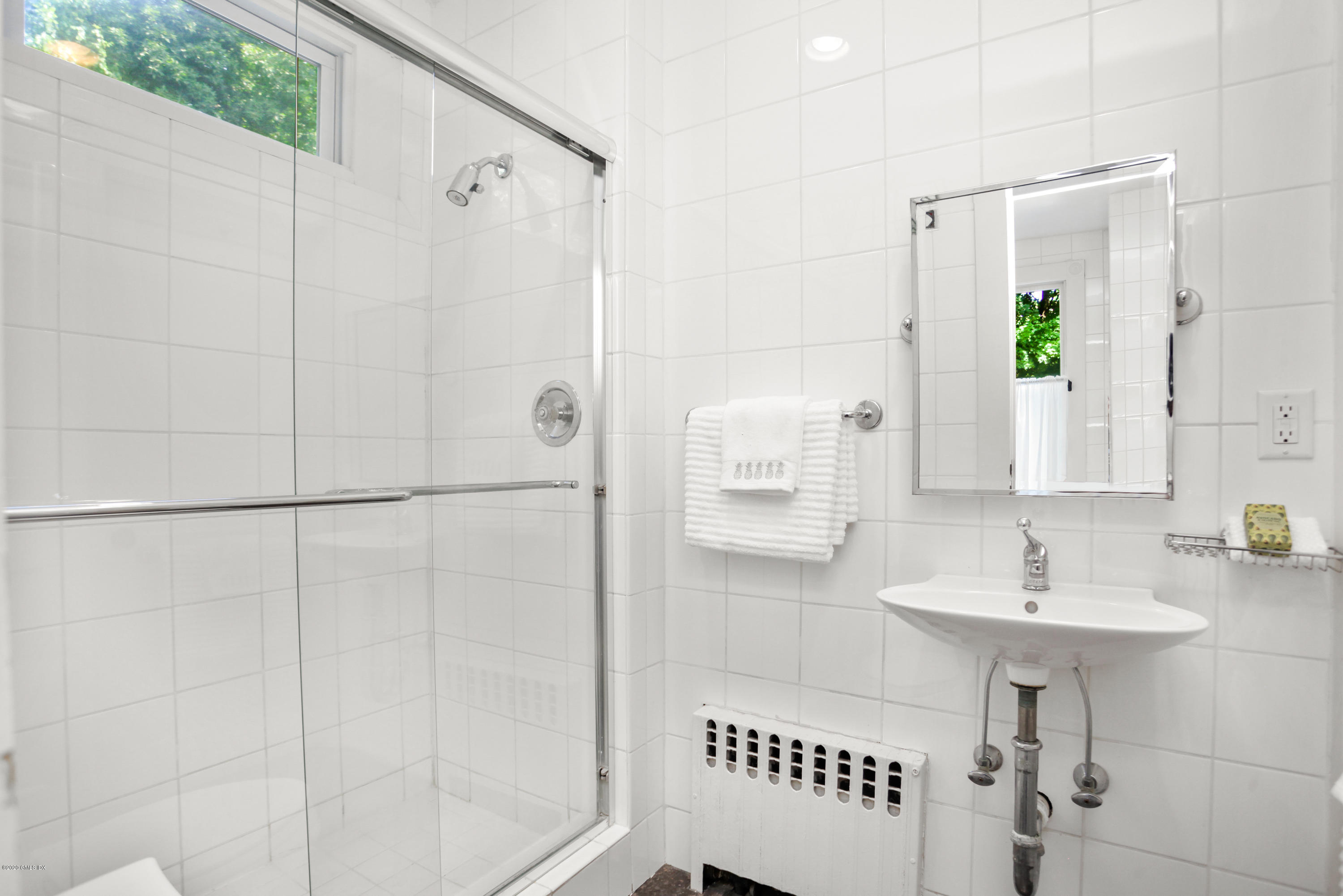 29 Weston Hill Road Riverside, CT 06878 - Photo 30 of 39 a bathroom with a sink and a mirror