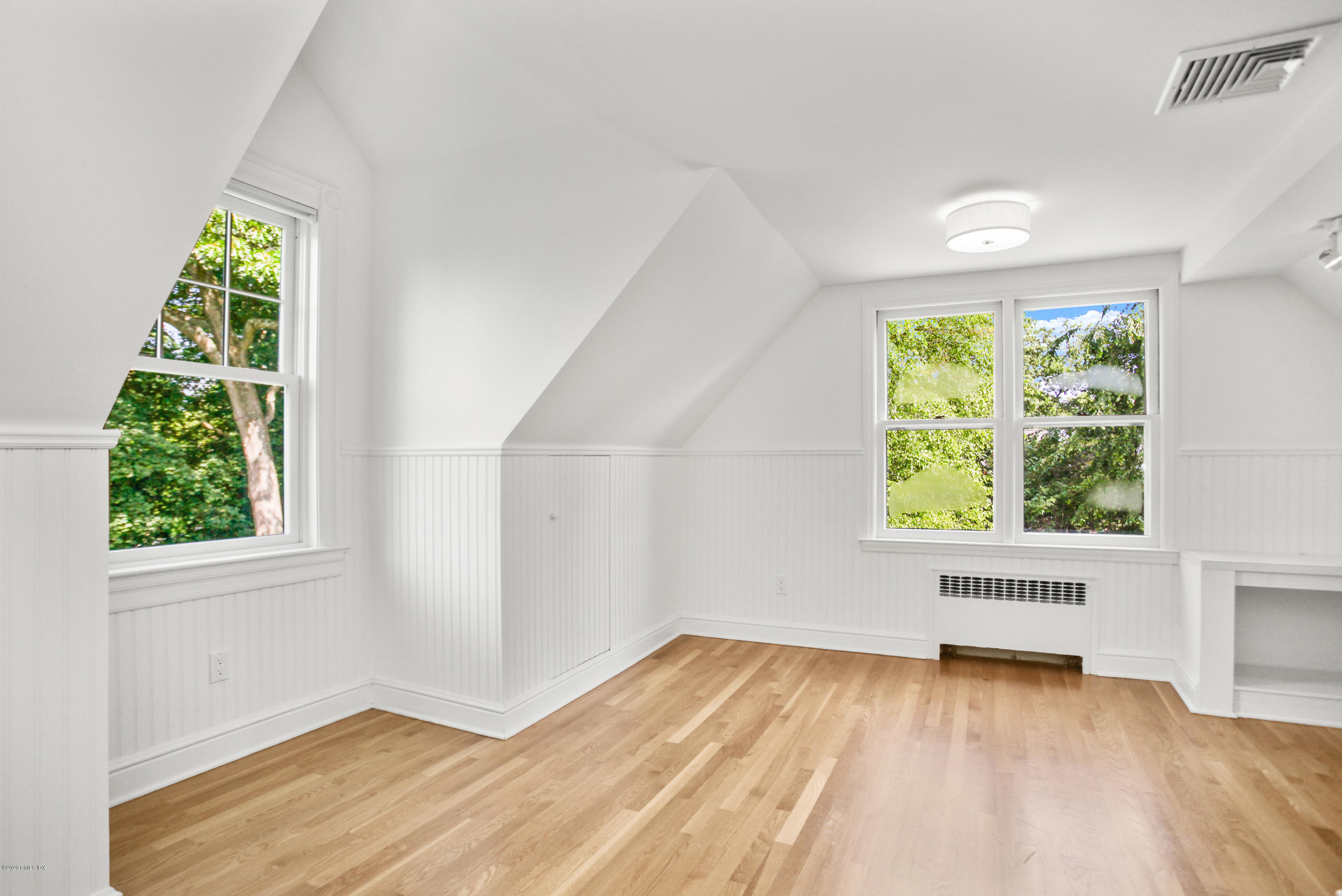 29 Weston Hill Road Riverside, CT 06878 - Photo 33 of 39 an empty room with wooden floor and windows