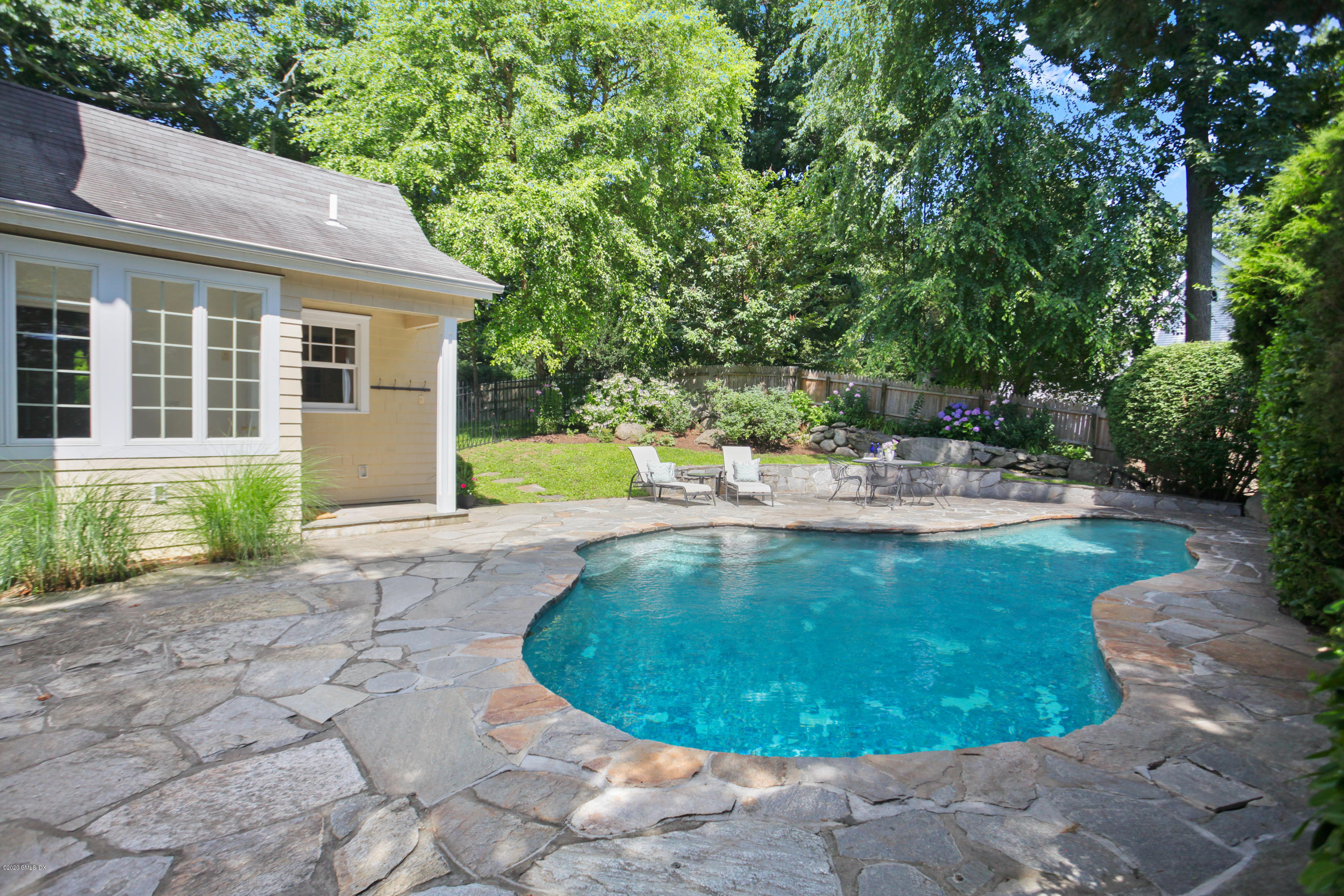 29 Weston Hill Road Riverside, CT 06878 - Photo 38 of 39 a view of a house with backyard and sitting area