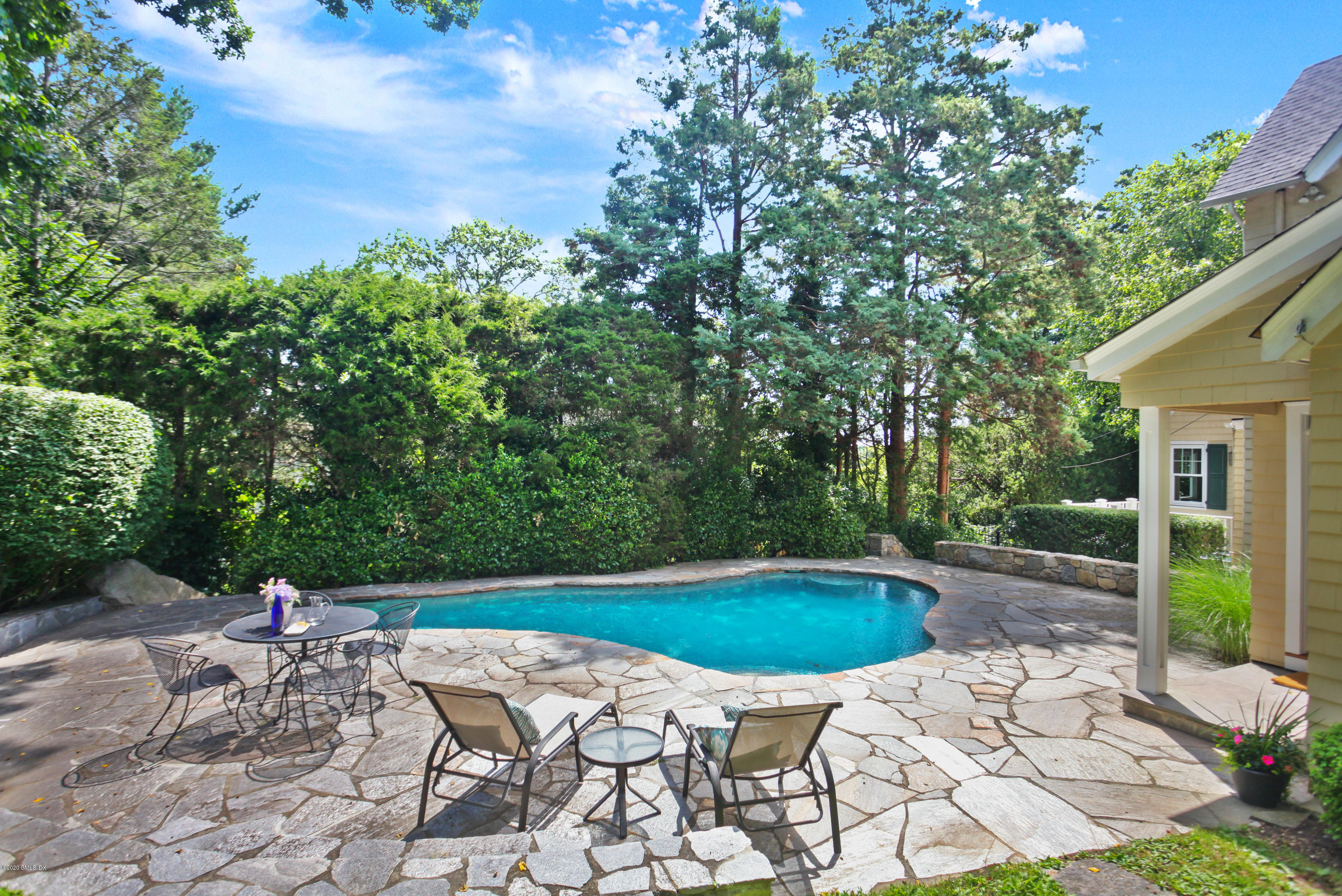 29 Weston Hill Road Riverside, CT 06878 - Photo 4 of 39 a view of a swimming pool with a patio