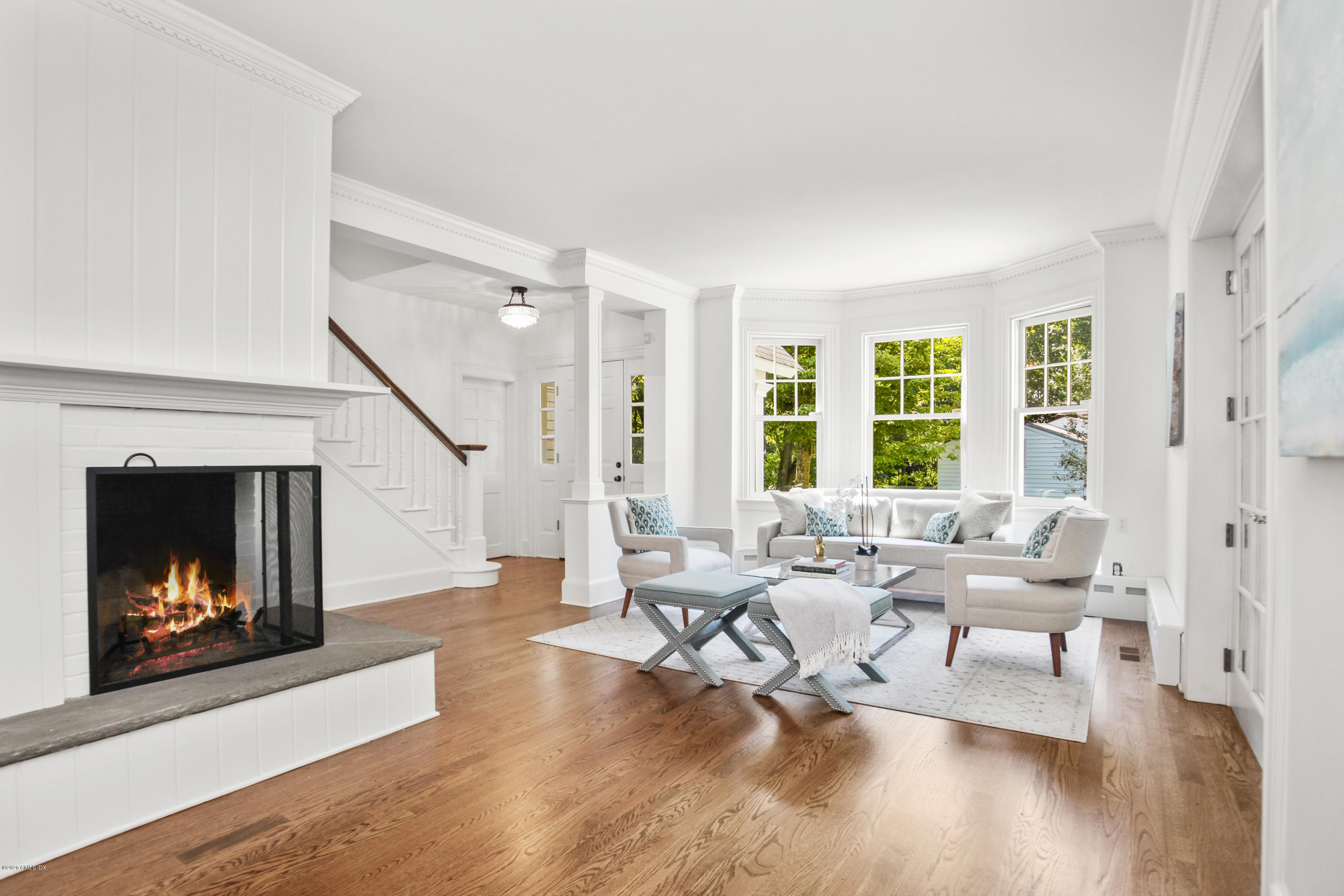 29 Weston Hill Road Riverside, CT 06878 - Photo 7 of 39 a living room with furniture and a fireplace