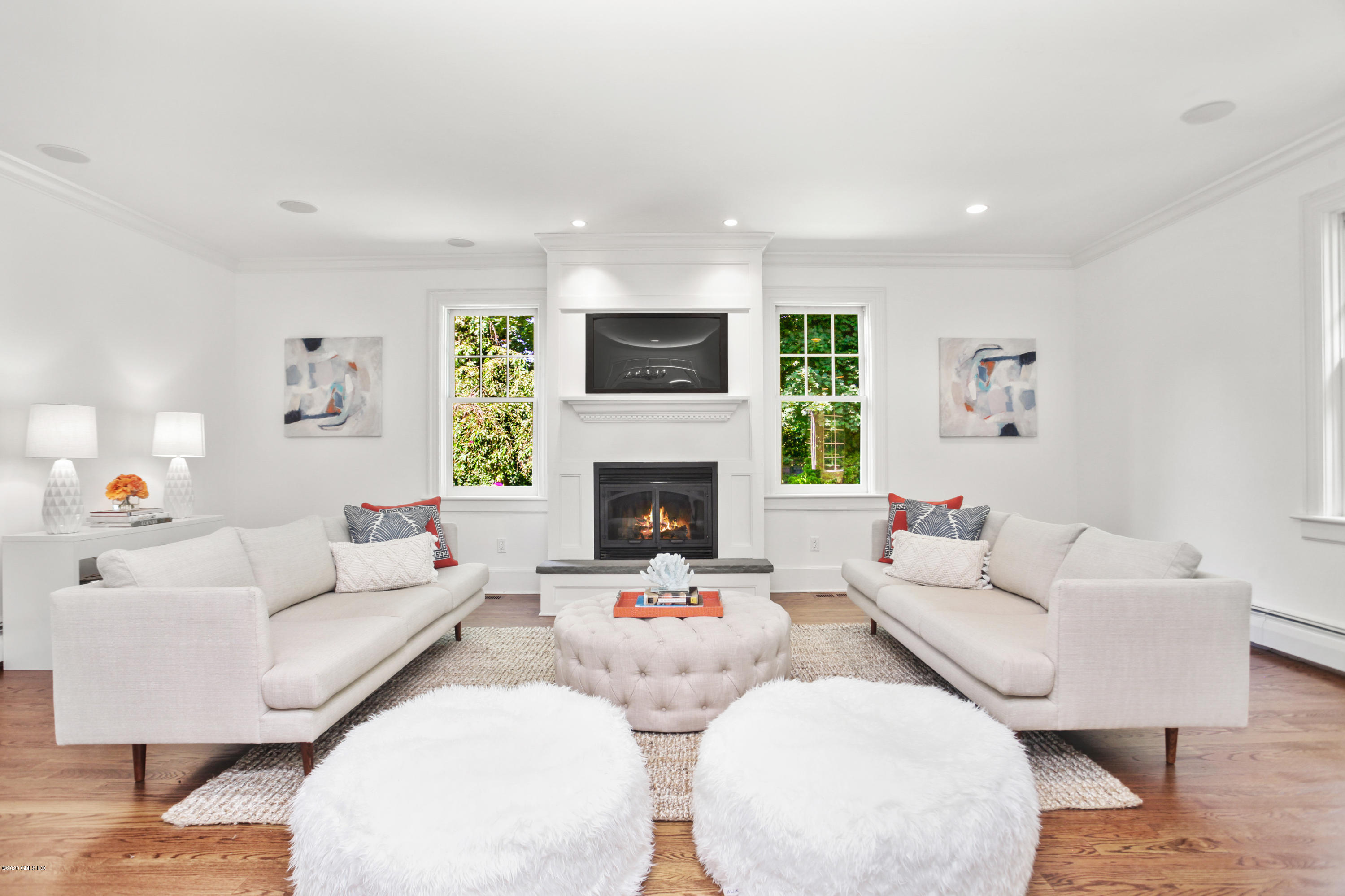 29 Weston Hill Road Riverside, CT 06878 - Photo 8 of 39 a living room with furniture and a fireplace